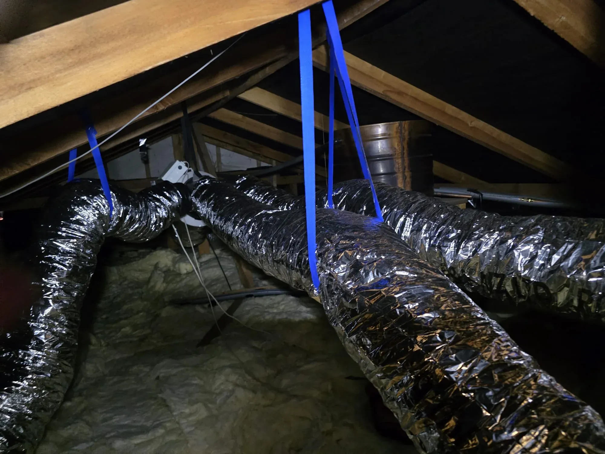 Insulated ducting running through a roof space