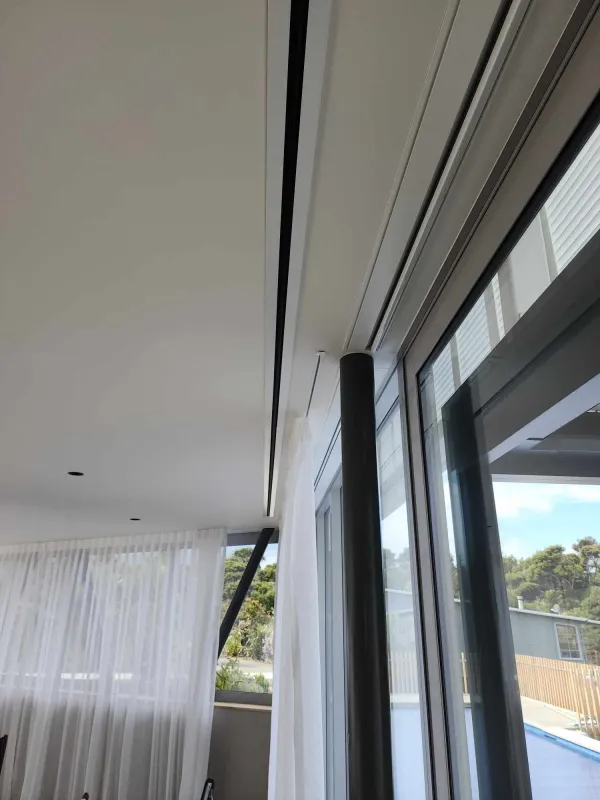 Rectangular floor grille outlet set into a living area floor