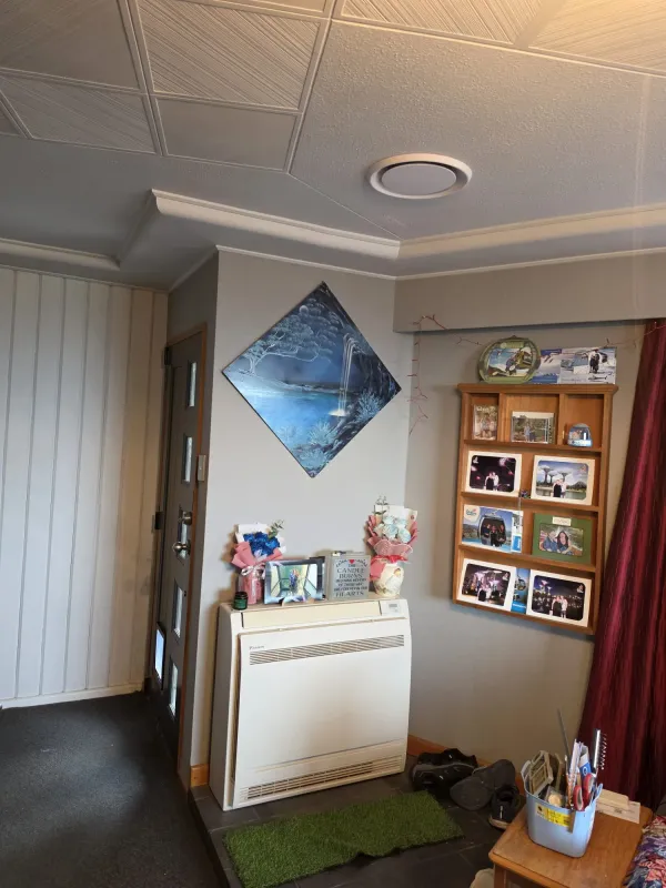 High wall heat pump fitted in a living area
