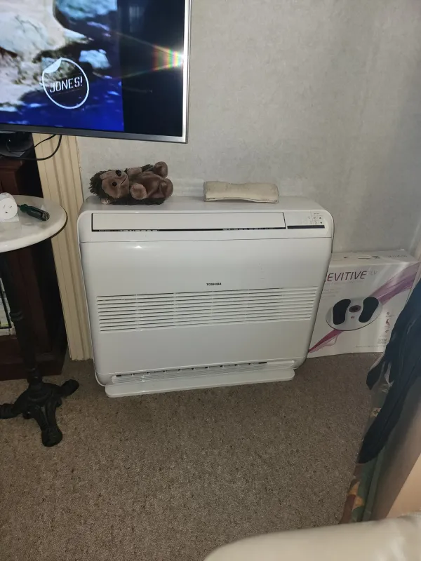 High wall heat pump fitted in a dining area