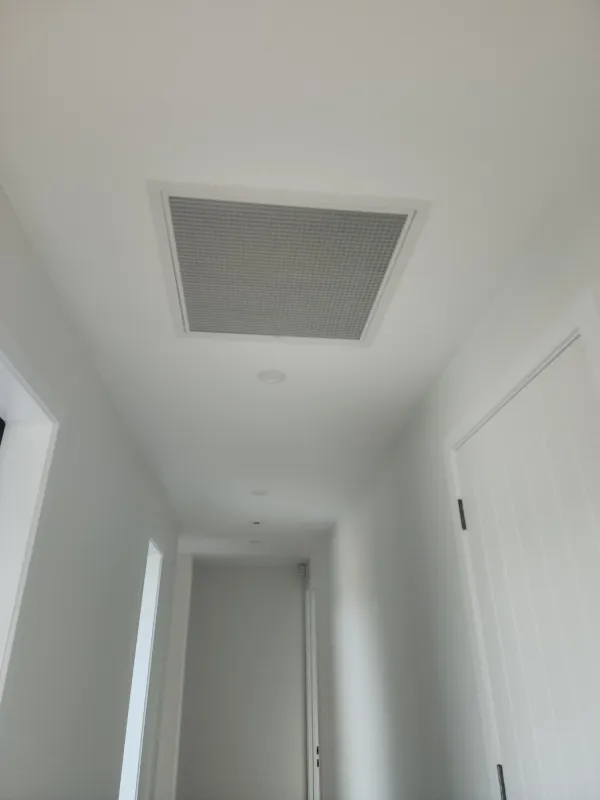 Return air grille set into a living area ceiling