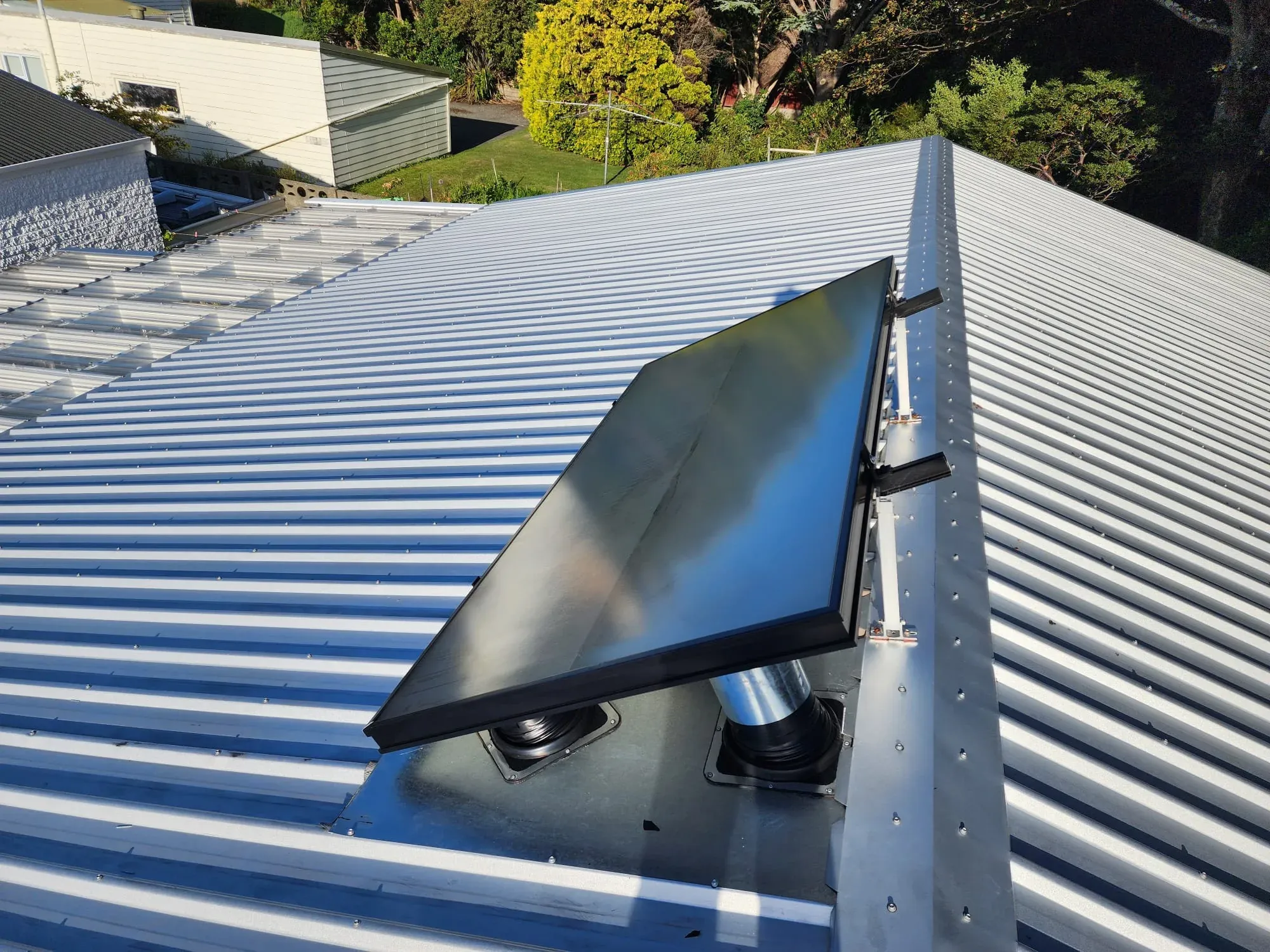 Tempered glass solar air panel on a corrugated iron roof