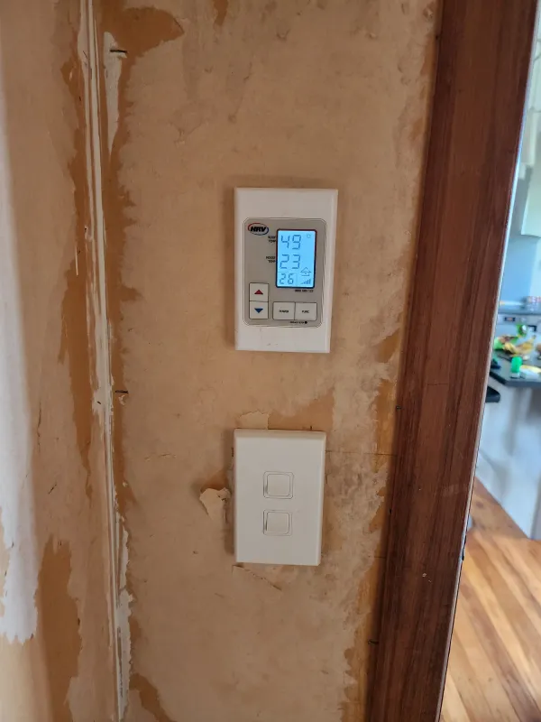Digital wall controller for solar air heating fitted beside a light switch