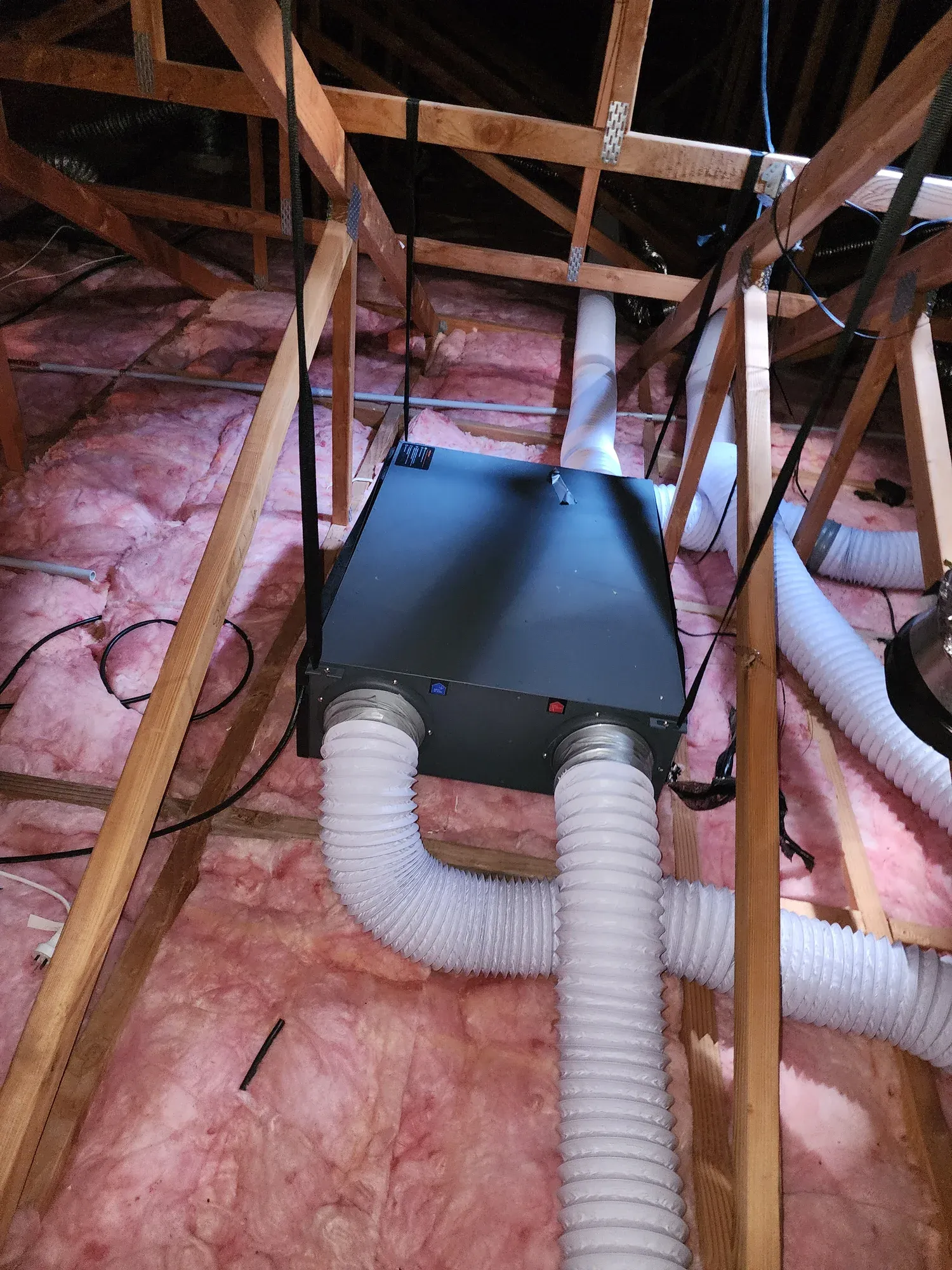 Air handling unit installed in a roof space